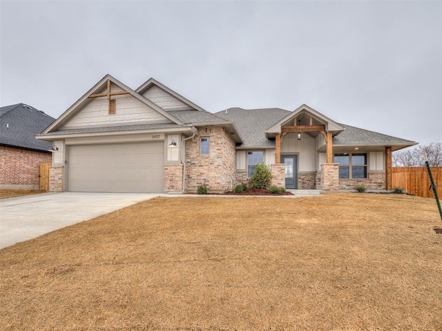 view of front of house featuring a garage and a front yard