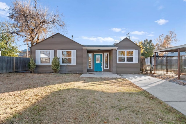 ranch-style home with a front lawn