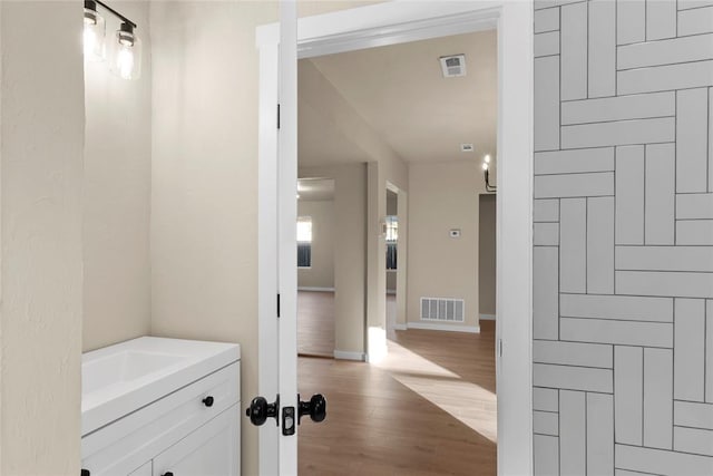 corridor featuring light hardwood / wood-style flooring