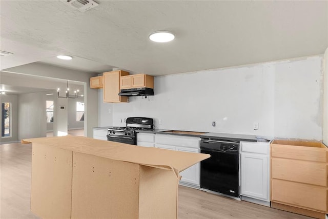 kitchen featuring a center island, black appliances, a kitchen breakfast bar, light wood-type flooring, and a notable chandelier