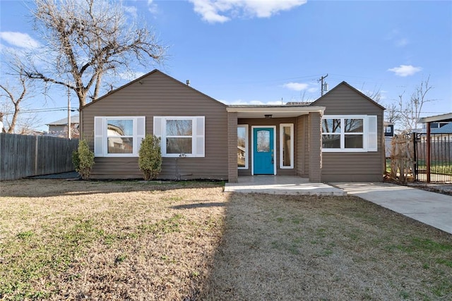 ranch-style house with a front lawn and fence