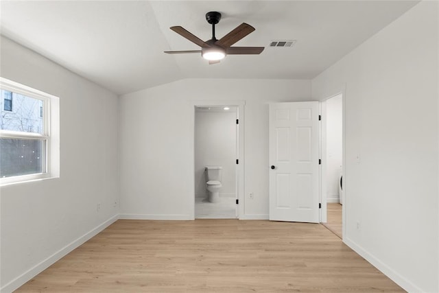 unfurnished bedroom featuring light wood-style floors, visible vents, ensuite bathroom, and baseboards