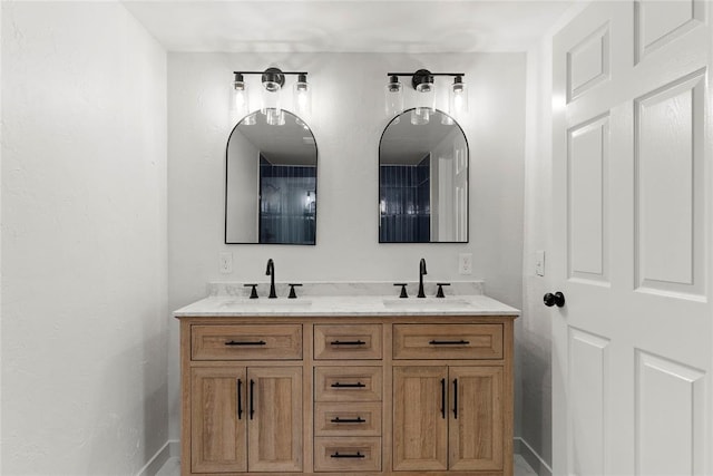 bathroom with double vanity and a sink