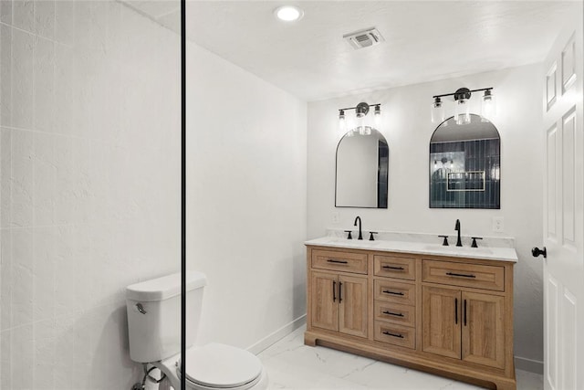 bathroom featuring a sink, visible vents, toilet, and marble finish floor