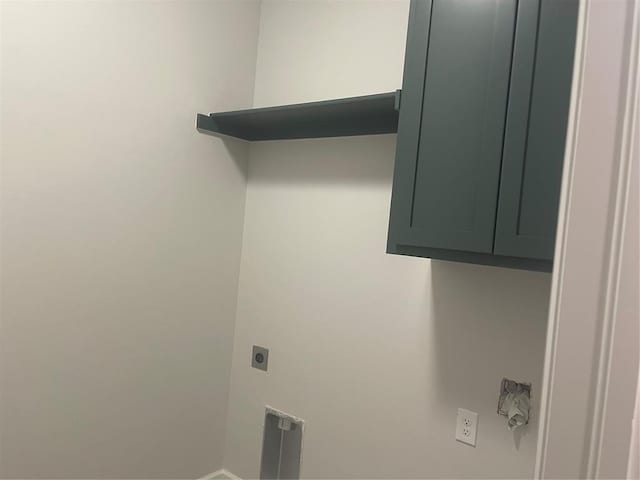 laundry area featuring cabinets and hookup for an electric dryer