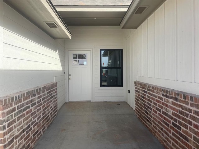 property entrance with a patio