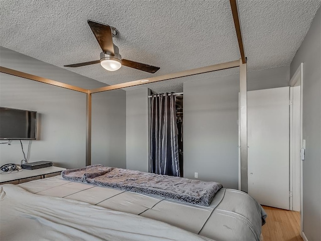 bedroom featuring ceiling fan and light wood-type flooring