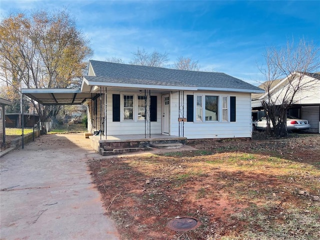 view of front of home featuring a carport and a porch