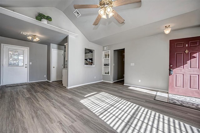 unfurnished living room featuring ceiling fan, dark wood-type flooring, and lofted ceiling