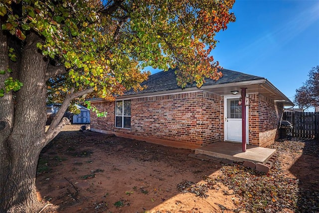 view of property exterior featuring a storage shed