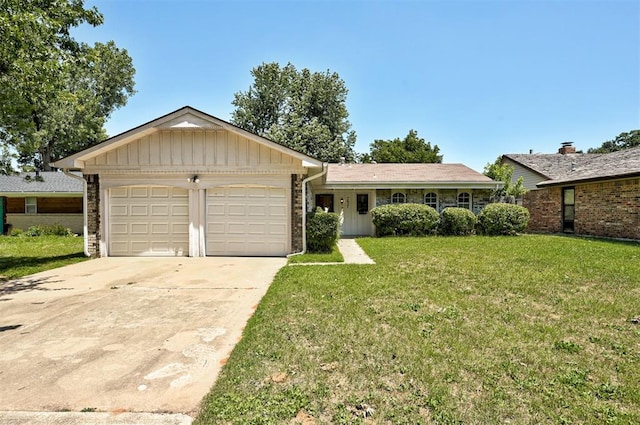 ranch-style home with a front yard and a garage