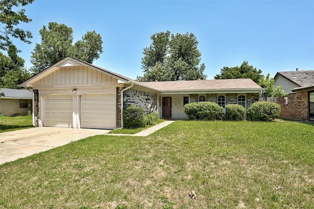 ranch-style home with a garage and a front lawn