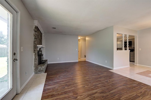 unfurnished living room featuring hardwood / wood-style flooring