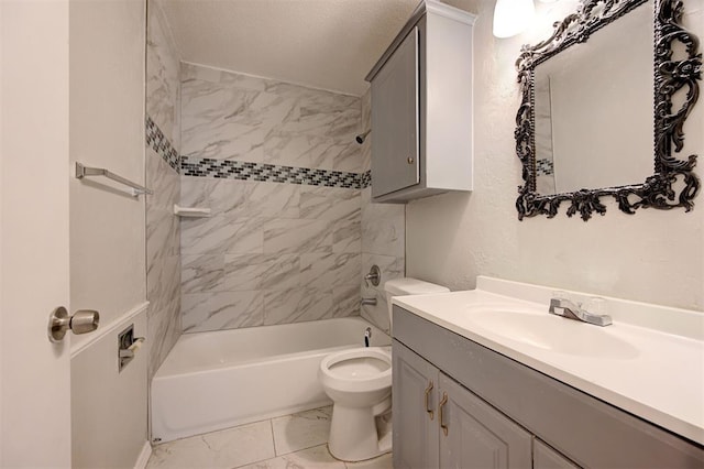 full bathroom with vanity, tiled shower / bath combo, and toilet