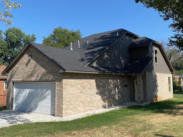 exterior space with a yard and a garage