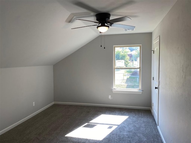 bonus room with dark colored carpet, ceiling fan, and lofted ceiling