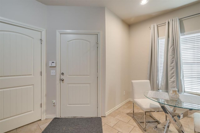 foyer with light tile patterned floors