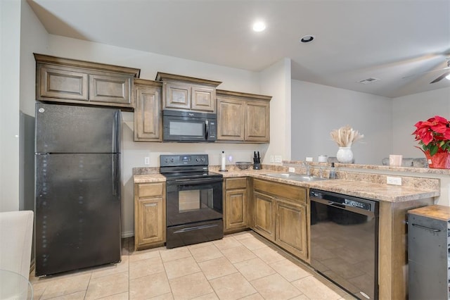 kitchen featuring ceiling fan, sink, kitchen peninsula, light tile patterned flooring, and black appliances