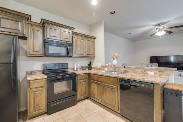 kitchen featuring ceiling fan, sink, kitchen peninsula, light tile patterned floors, and black appliances