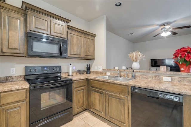 kitchen featuring light tile patterned flooring, sink, ceiling fan, and black appliances