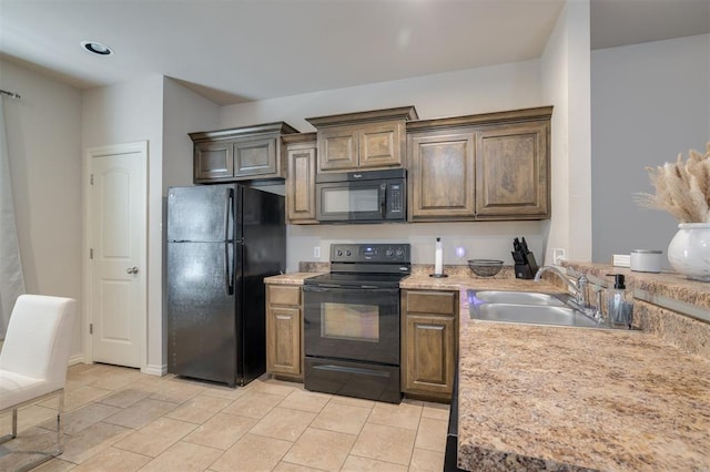 kitchen with sink and black appliances