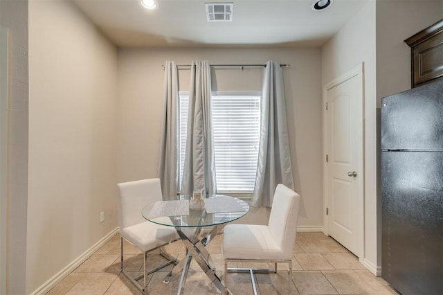 dining space with light tile patterned flooring