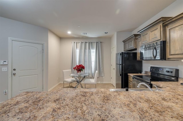 kitchen with sink and black appliances