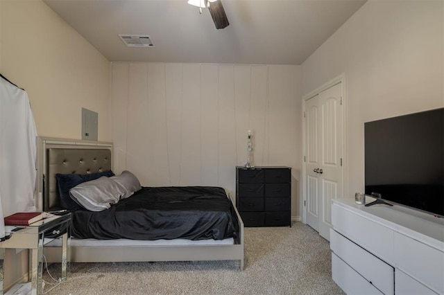 bedroom featuring ceiling fan and light colored carpet