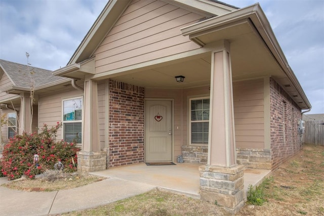 doorway to property featuring a porch