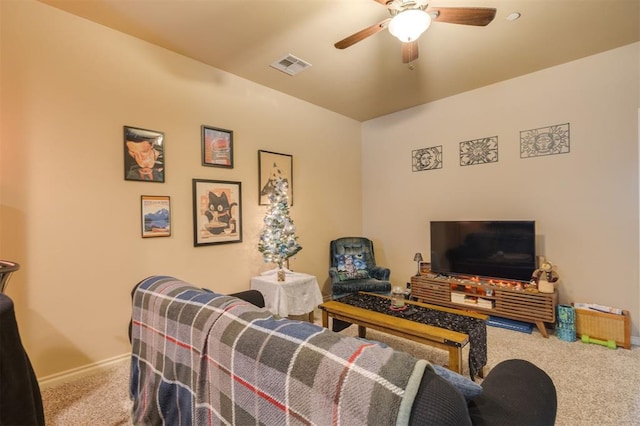 carpeted living room featuring ceiling fan