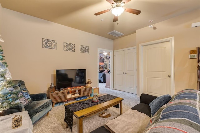 living room with light colored carpet and ceiling fan