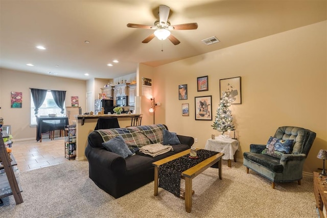 living room with light colored carpet and ceiling fan