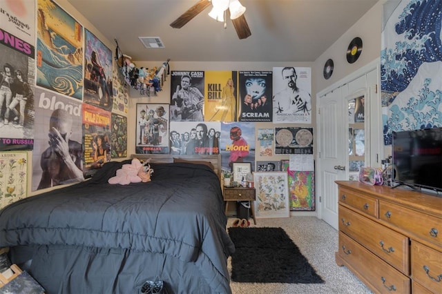 bedroom with ceiling fan and light carpet