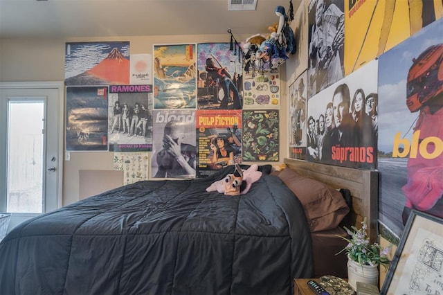 bedroom with multiple windows