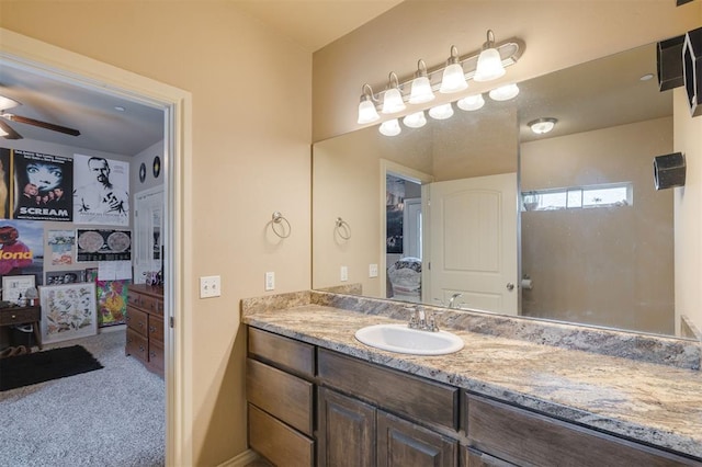 bathroom with ceiling fan and vanity