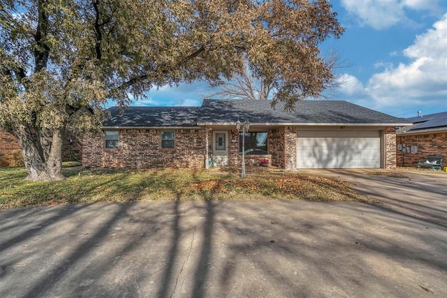 single story home featuring a garage