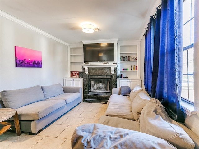 living room with a fireplace, light tile patterned floors, and a healthy amount of sunlight