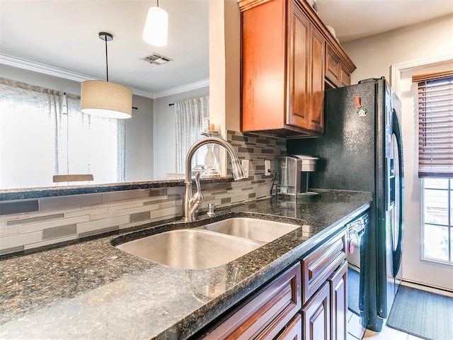 kitchen with sink, tasteful backsplash, crown molding, decorative light fixtures, and light tile patterned floors