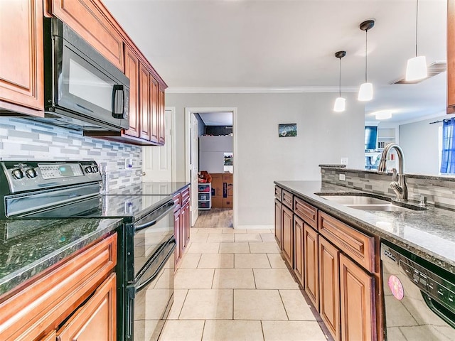 kitchen with pendant lighting, black appliances, crown molding, sink, and tasteful backsplash