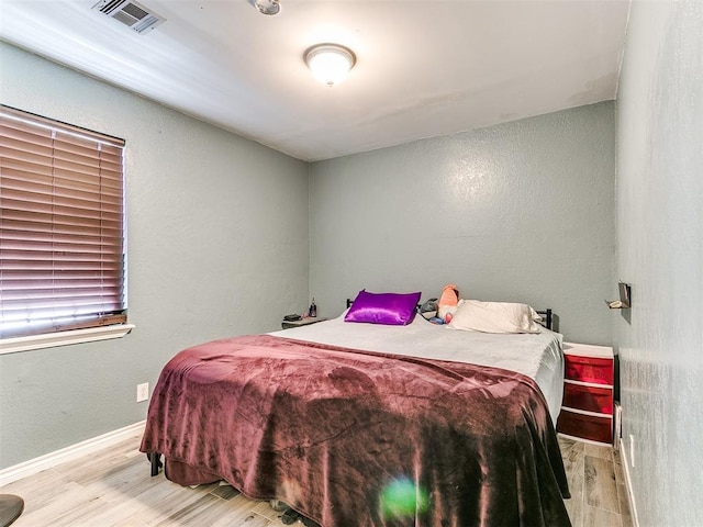 bedroom with light wood-type flooring