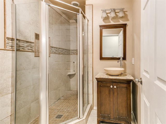 bathroom with vanity, tile patterned floors, and an enclosed shower