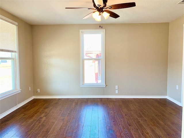 unfurnished room featuring ceiling fan and dark hardwood / wood-style floors