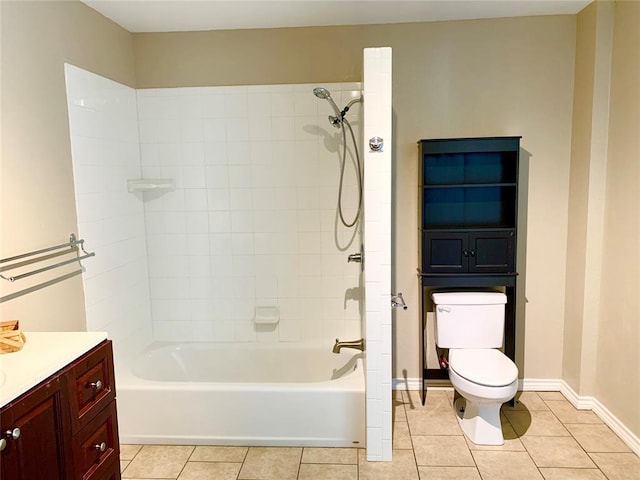 full bathroom featuring toilet, tile patterned flooring, tiled shower / bath, and vanity