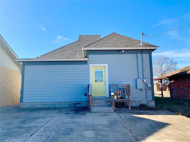 rear view of property featuring a patio