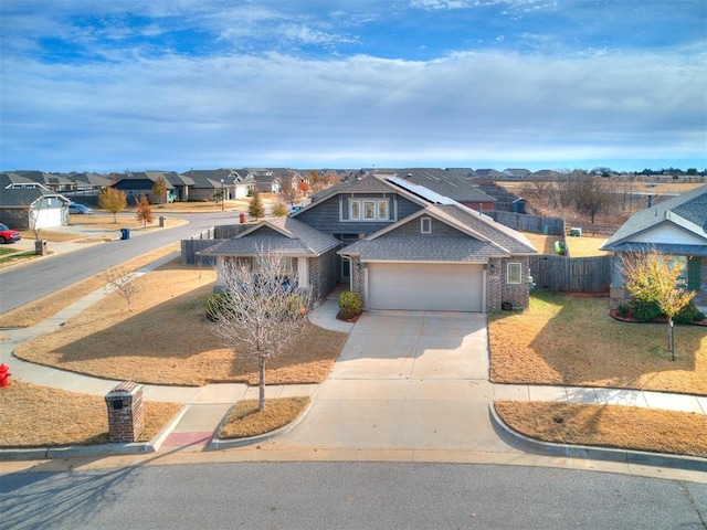 view of front of home featuring a front lawn and a garage