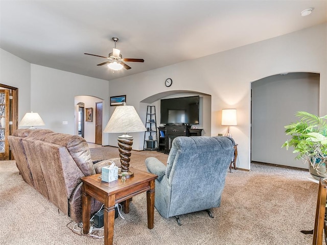 carpeted living room featuring ceiling fan