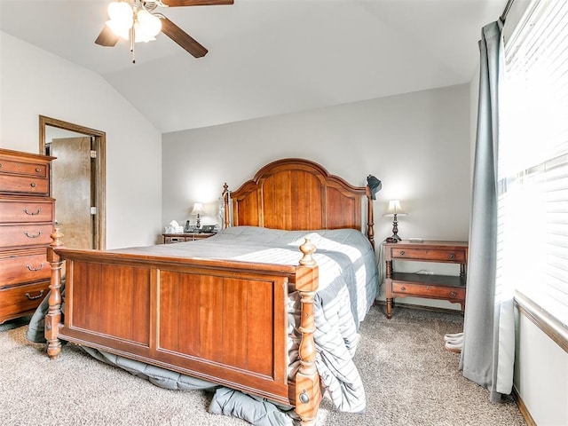 carpeted bedroom featuring ceiling fan and lofted ceiling