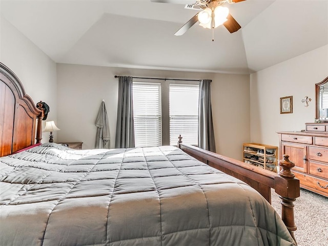 carpeted bedroom featuring ceiling fan and lofted ceiling