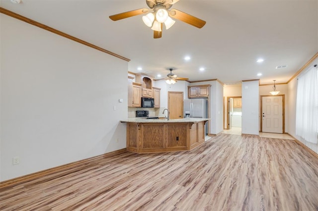 kitchen with black appliances, sink, crown molding, light hardwood / wood-style floors, and kitchen peninsula