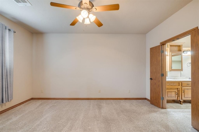 spare room with light carpet and ceiling fan